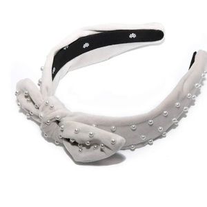 Lele Sadoughi pearly velvet knot bow headband in ivory!